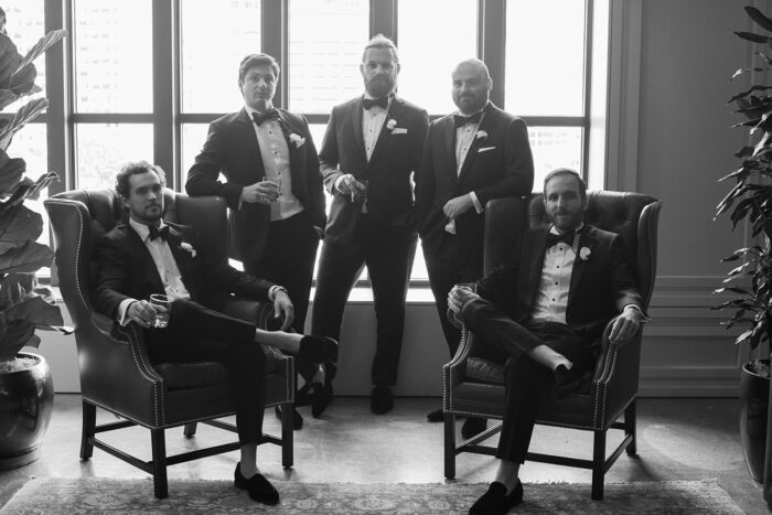 Groom with groomsmen sitting at the Chicago Old Post Office