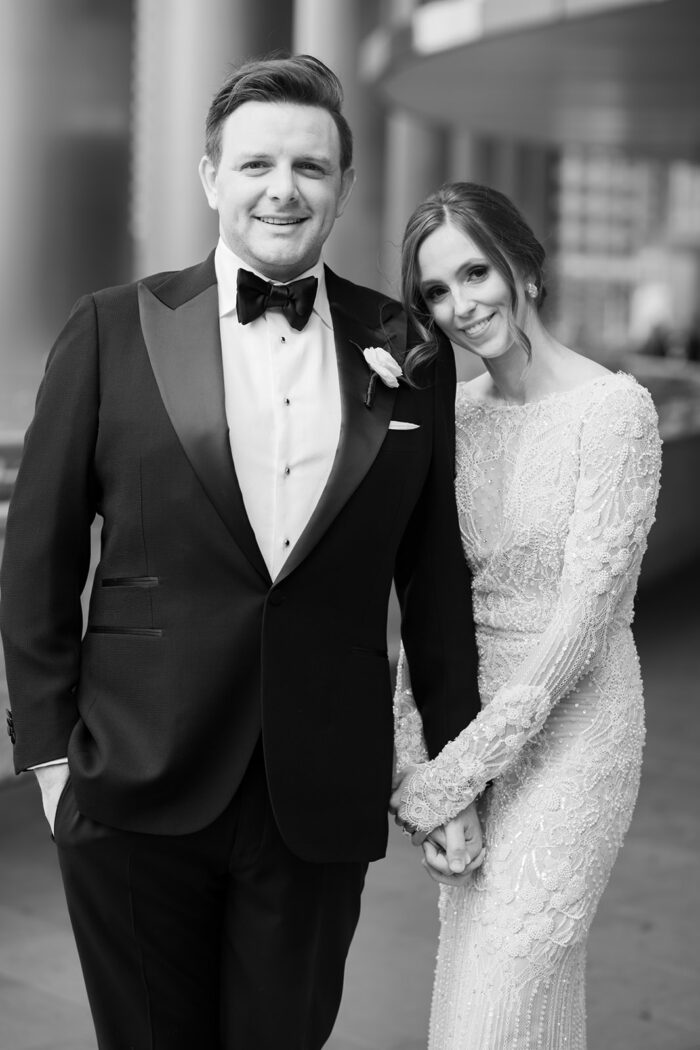 Bride leaning on her groom during Chicago wedding portraits