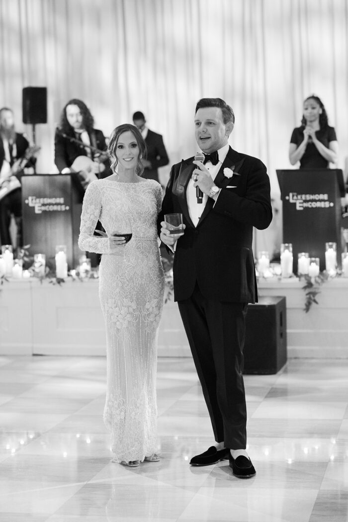 Bride and groom giving a speech at their Chicago wedding at the Old Post Office