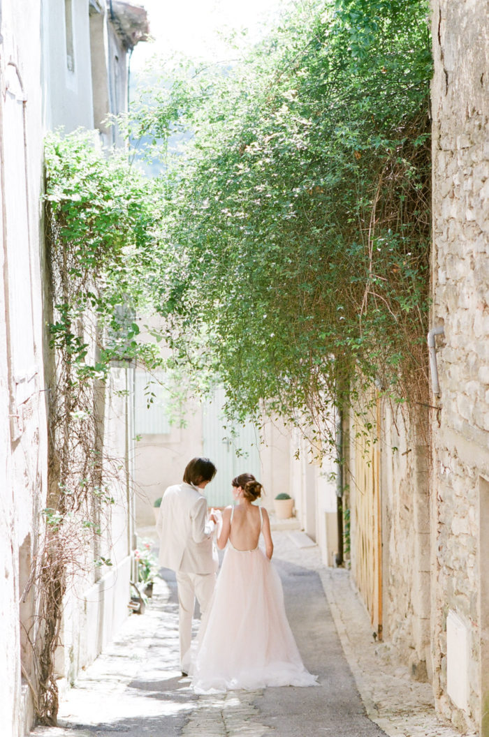 Couple walking down a romantic street in Provence