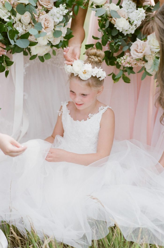 Flower girl in white tulle dress at Spruce Mountain Ranch in Colorado