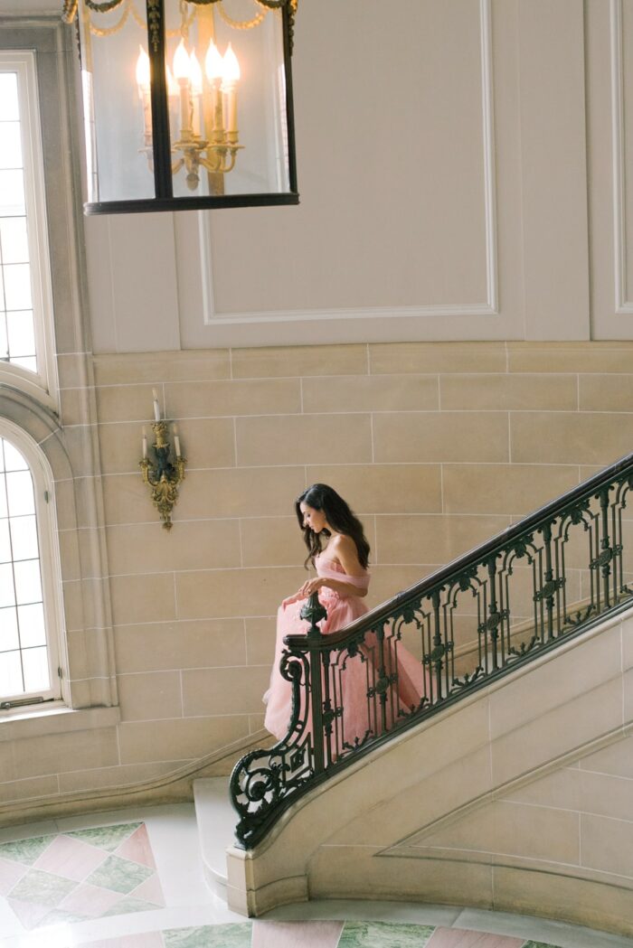 Bride walking down the stairs at Armour House in Lake Forest Illinois