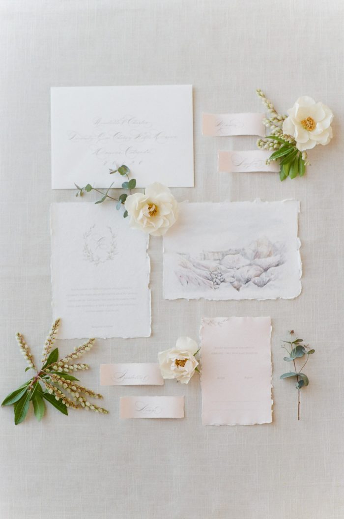 Invitation suite styled with florals for a wedding in Aspen Colorado