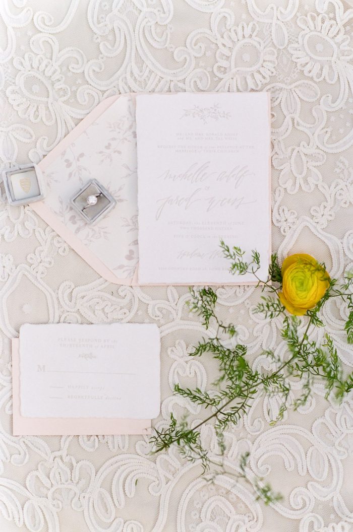 Invitation suite styled with florals at an Aspen wedding