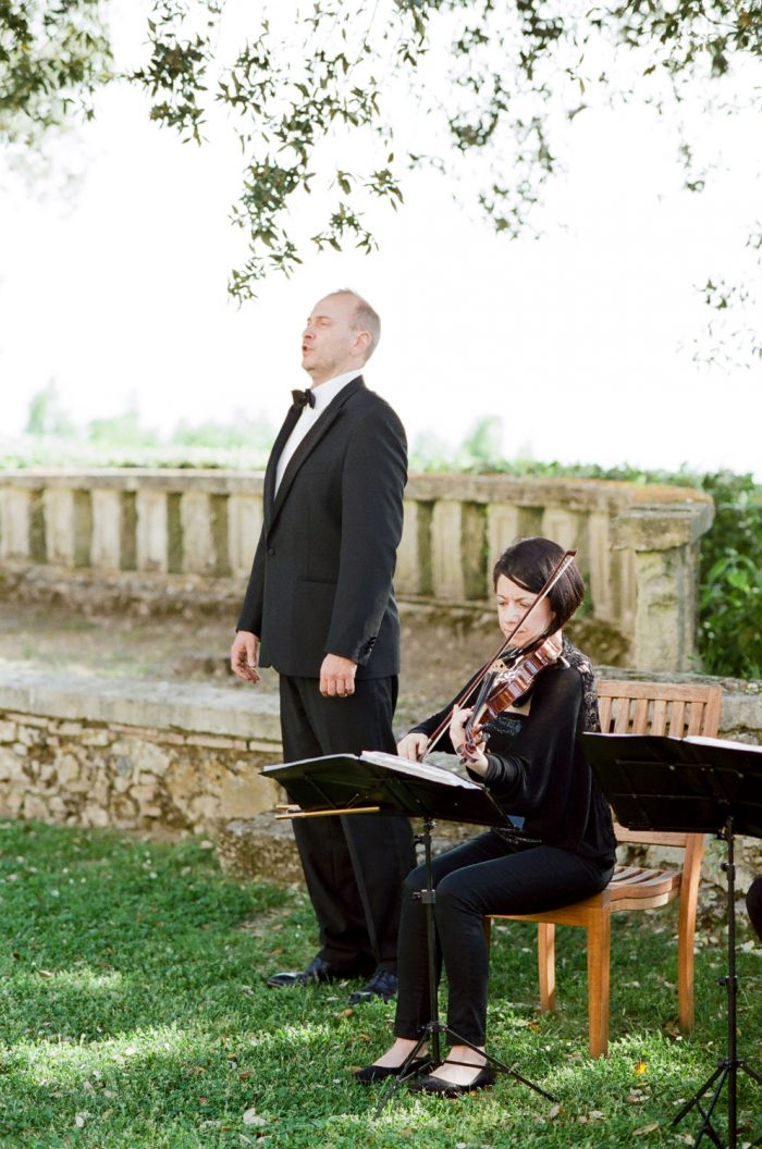 A singer performs during a wedding ceremony at Borgo Pignano in Tuscany