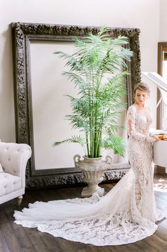 A bride wearing a Berta Bridal dress getting ready for her Castle Pines Colorado wedding