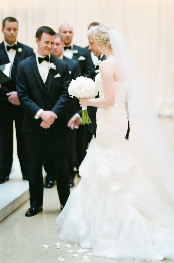 Father and bride walk down the aisle during a wedding ceremony at The Rookery in Chicago