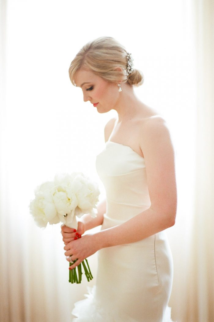 Bride holding a white bouquet at The Rookery in Chicago