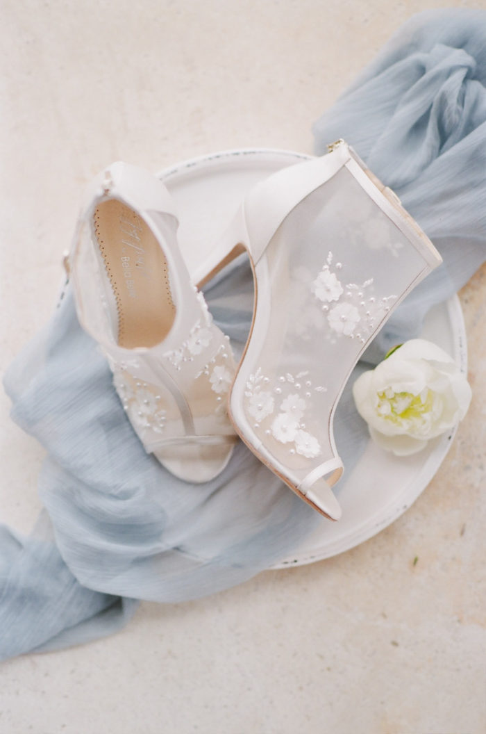 High heels styled on light blue fabric