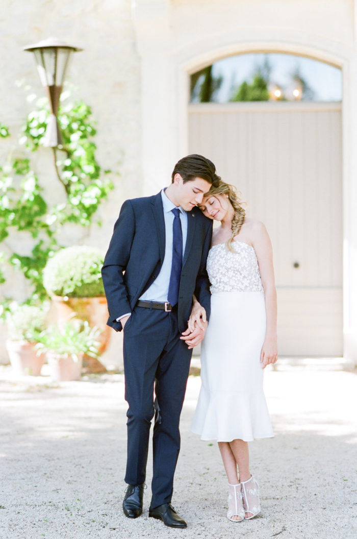Couple leaning their heads against one another in Provence
