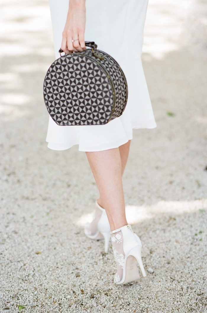 Woman holding a vintage purse during her honeymoon in Provence France