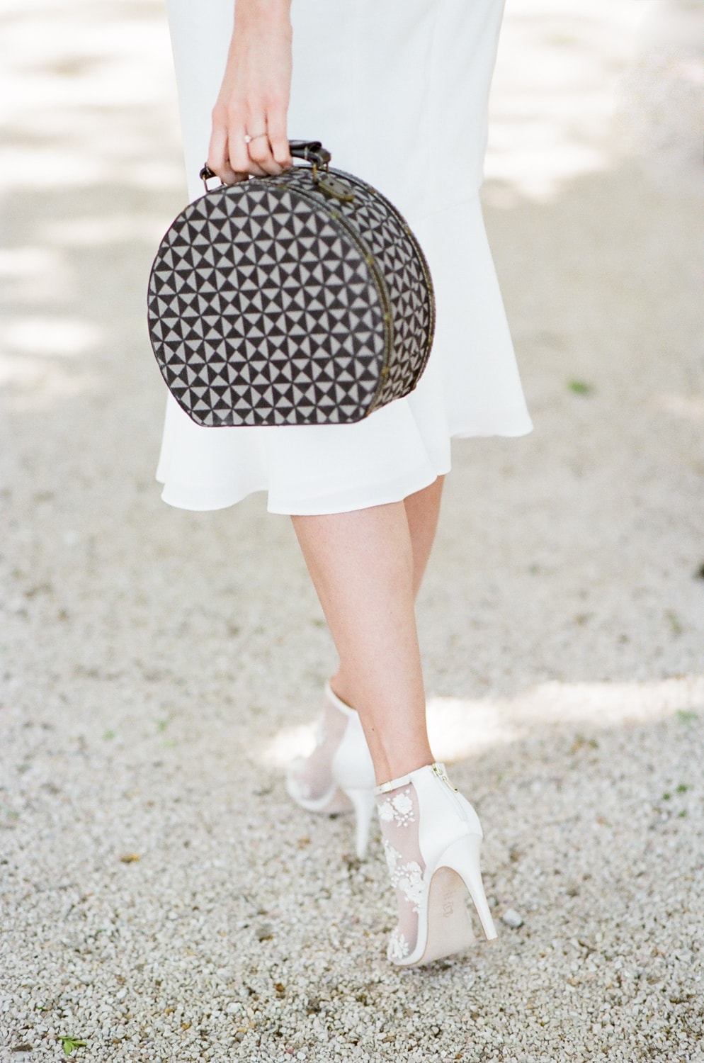Woman holding a vintage purse during her honeymoon in Provence France