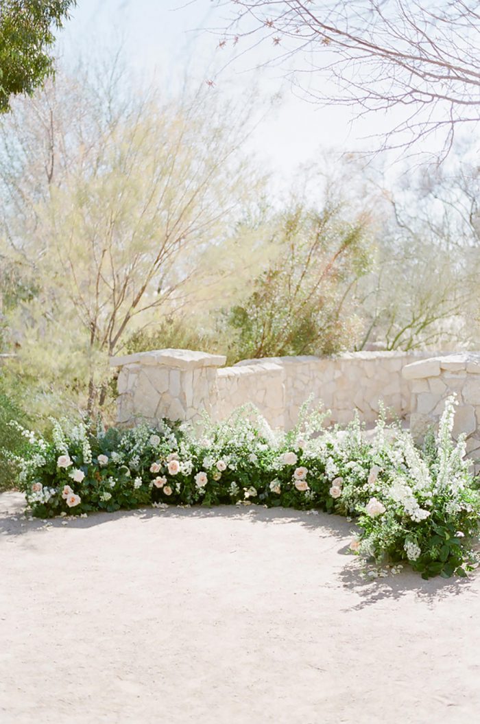 Curved floral decor at a wedding ceremony at the Springs Preserve in Las Vegas