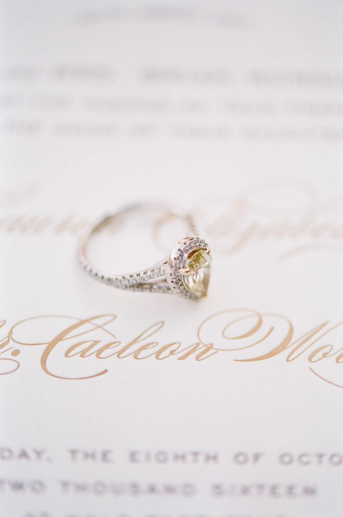 Engagement ring sitting on a wedding invitation at Spruce Mountain Ranch