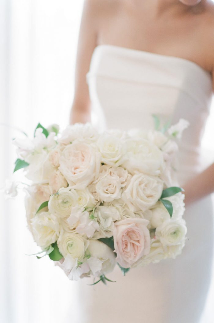 Bride holding a classic white bridal bouquet at The Four Seasons in Vail Colorado