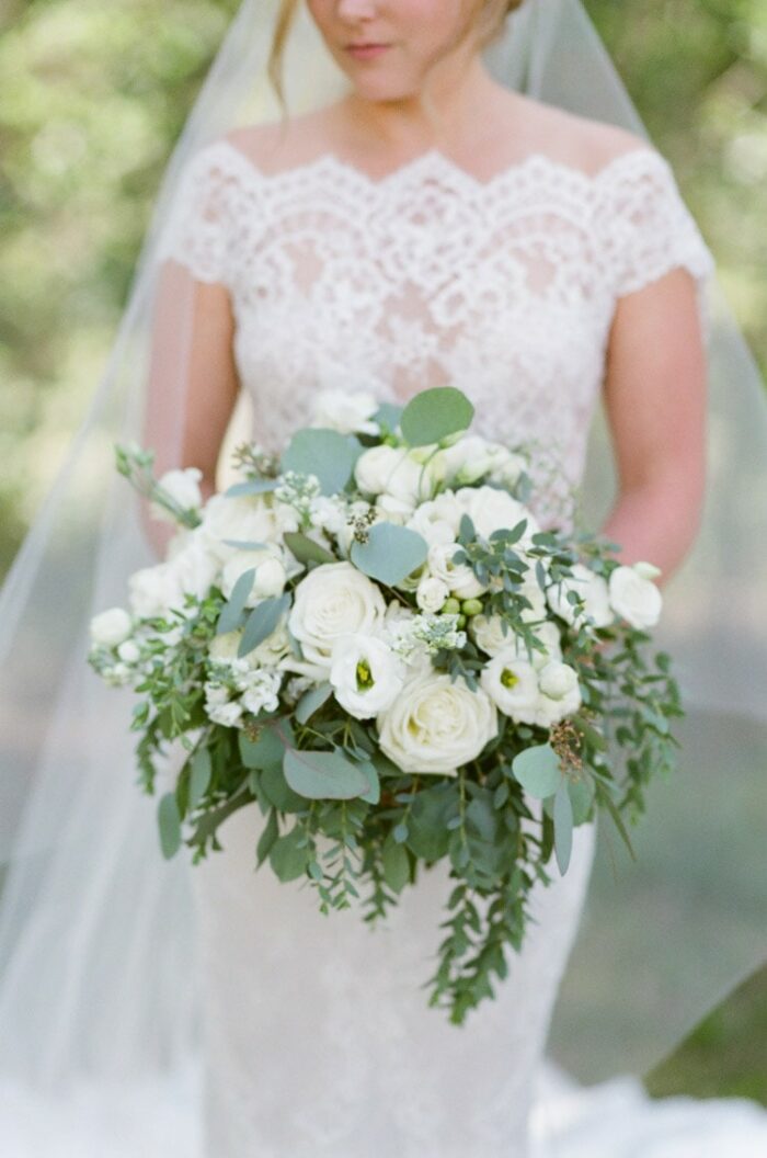 Bride holding white bouquet at Eaton Ranch wedding in Vail