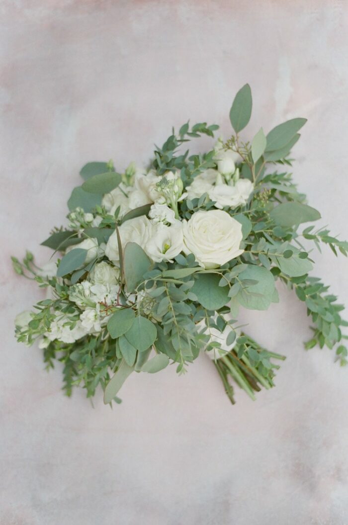 White bridal bouquet with greenery
