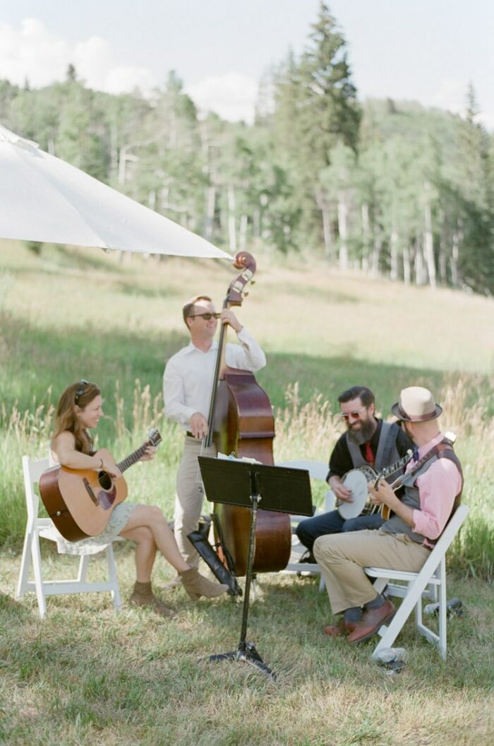 Ceremony musicians play at an outdoor summer wedding in Vail Colorado