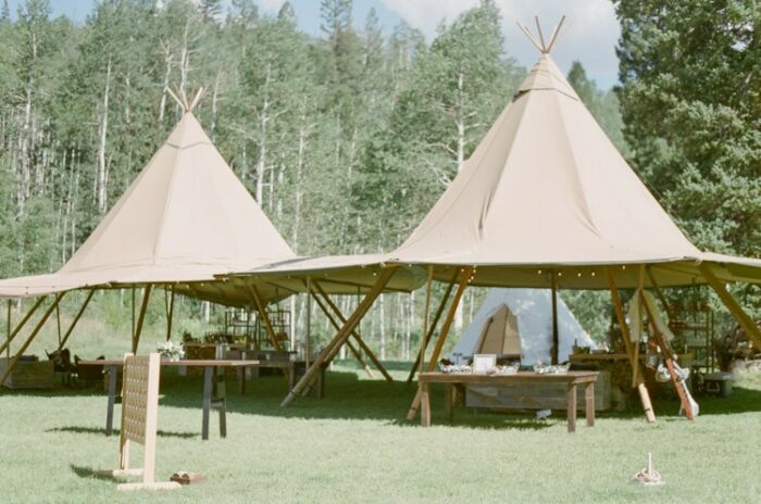 Modern teepee lounge area at an outdoor wedding reception in Vail Colorado