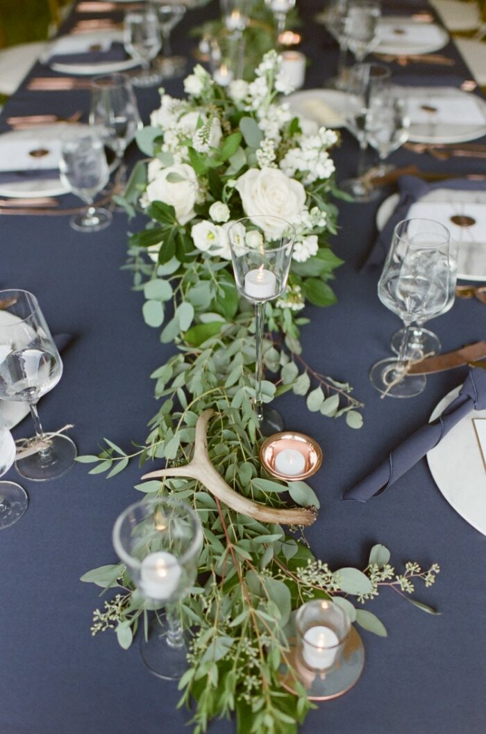 Rustic floral arrangement at a tented wedding reception in Vail Colorado