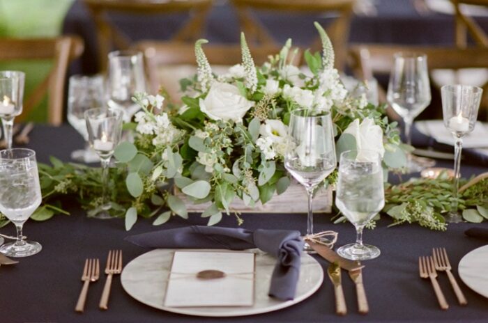 Rustic floral arrangement at a tented wedding reception in Vail Colorado