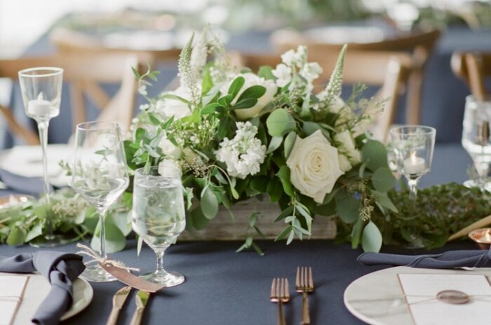 Rustic floral arrangement at a tented wedding reception in Vail Colorado