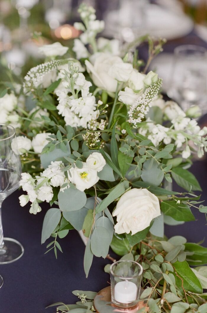 Rustic floral arrangement at a tented wedding reception in Vail Colorado