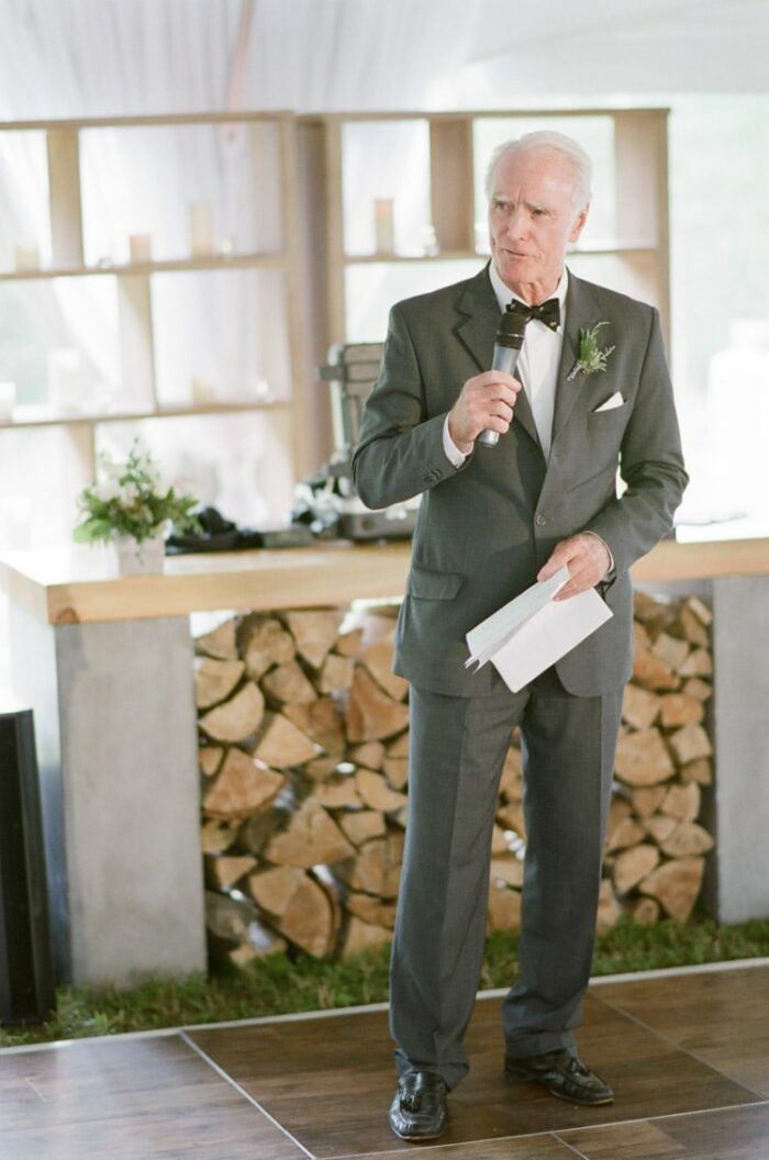 Man gives speech at a wedding reception at Eaton Ranch in Vail