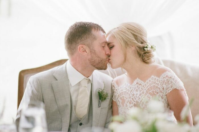 Bride and groom kiss during their reception at Eaton Ranch in Vail