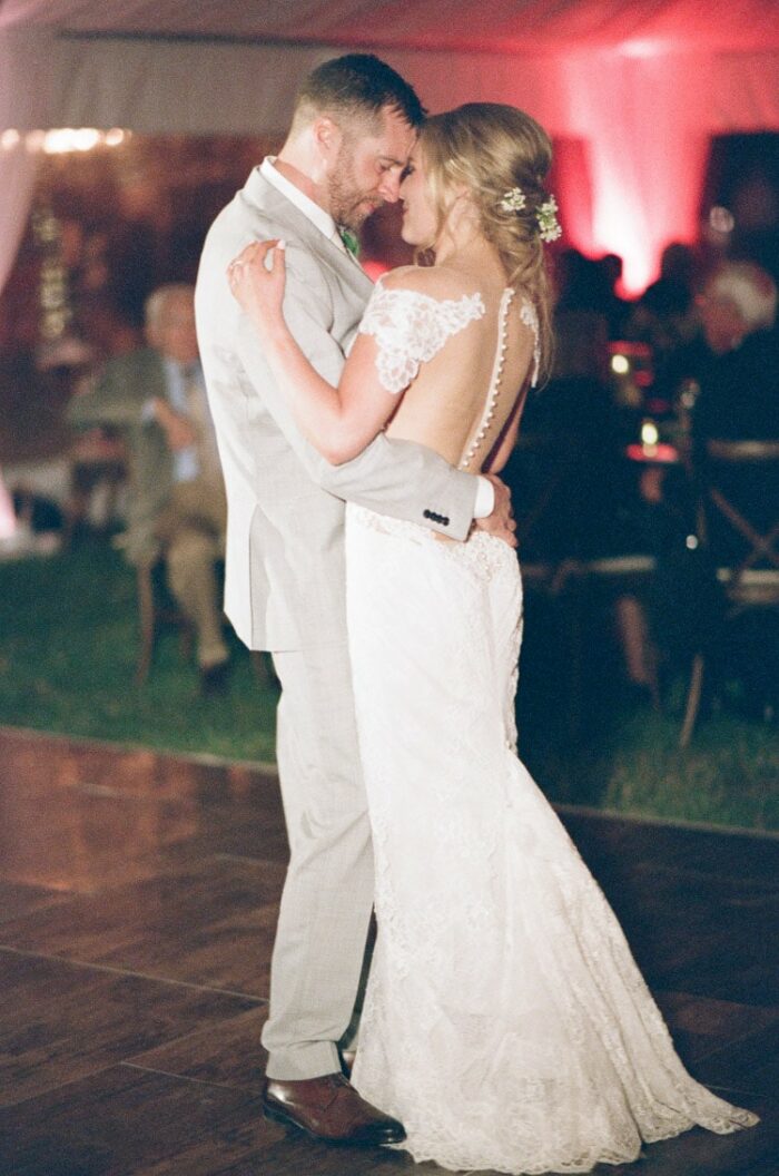 Bride and groom share a dance during their wedding reception at Eaton Ranch in Vail