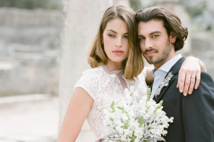 Bride and groom holding each other during their Provencal elopement at Glanum