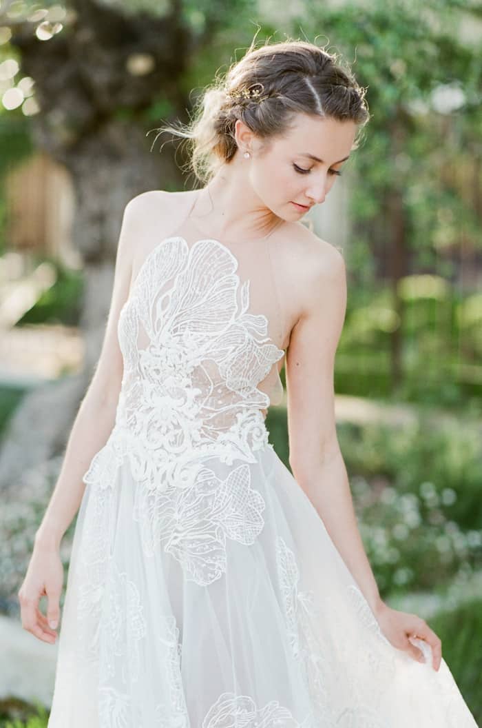 Bride showing of her Musat Official Wedding Dress featuring soft tulle, lace elements, and unique illusion bodice