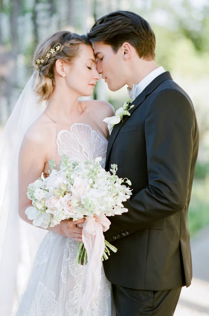 Man and woman facing close to each other romantically about to kiss