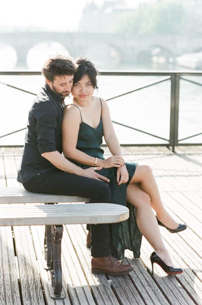 Engaged Couple Sitting On Bridge In Paris Engagement With WEP
