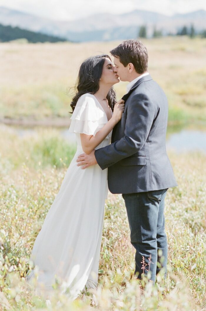 Engaged couple kissing in Vail Valley, Colorado