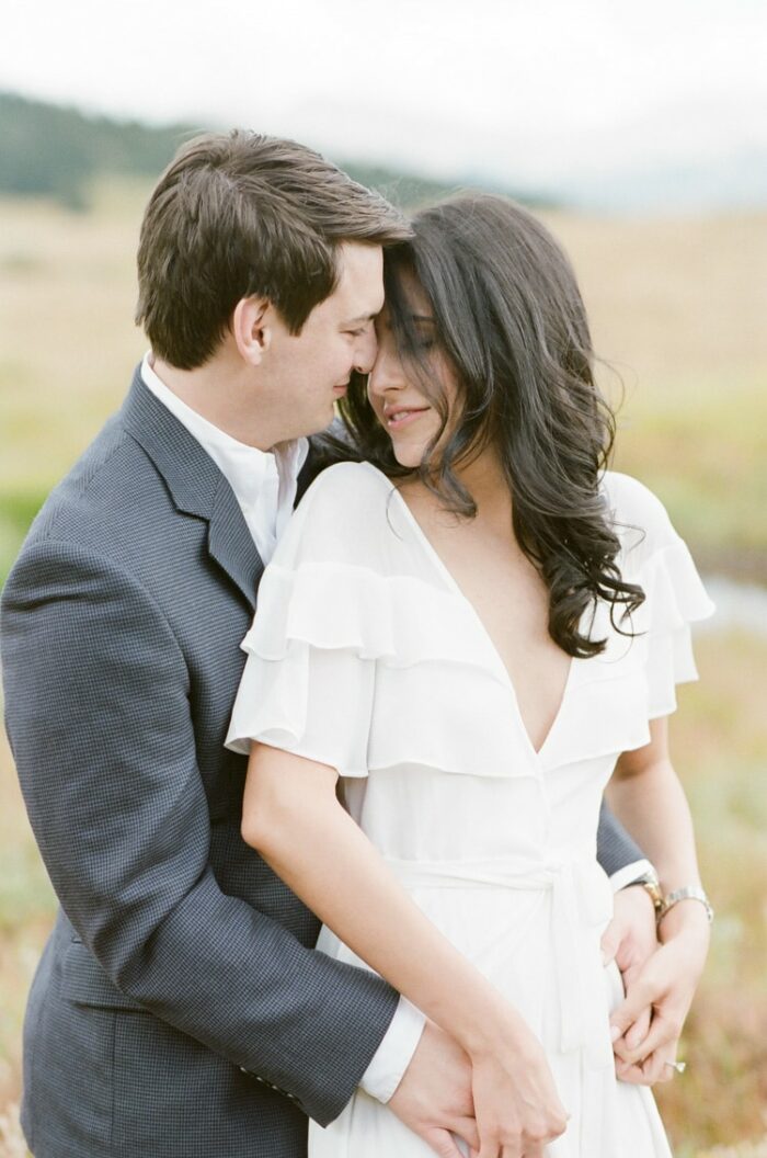 Fiance embracing his fiancee from behind