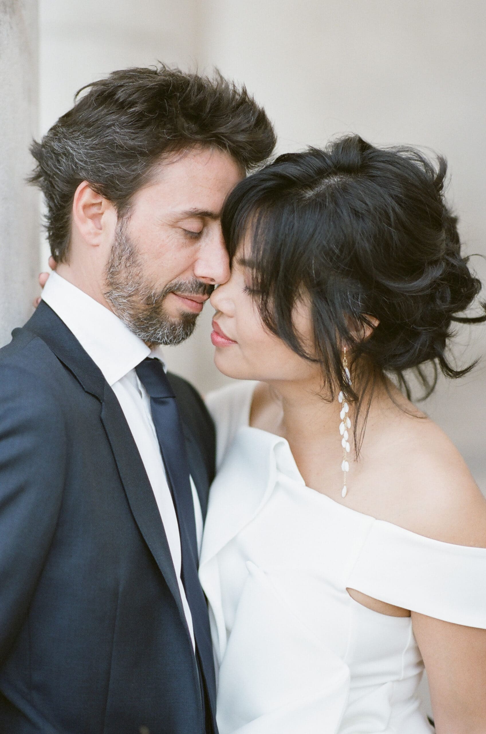 Parisian couple kissing each other at their engagement session in Paris