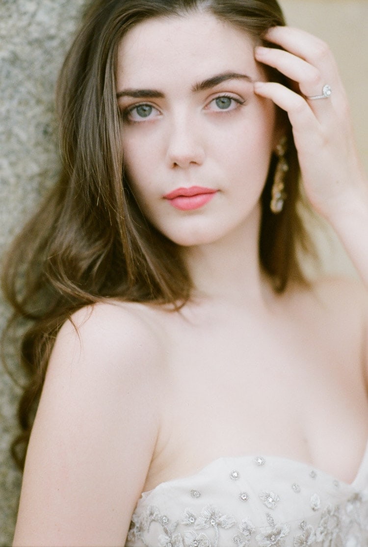 Portrait of a bride against an old wall in Spain
