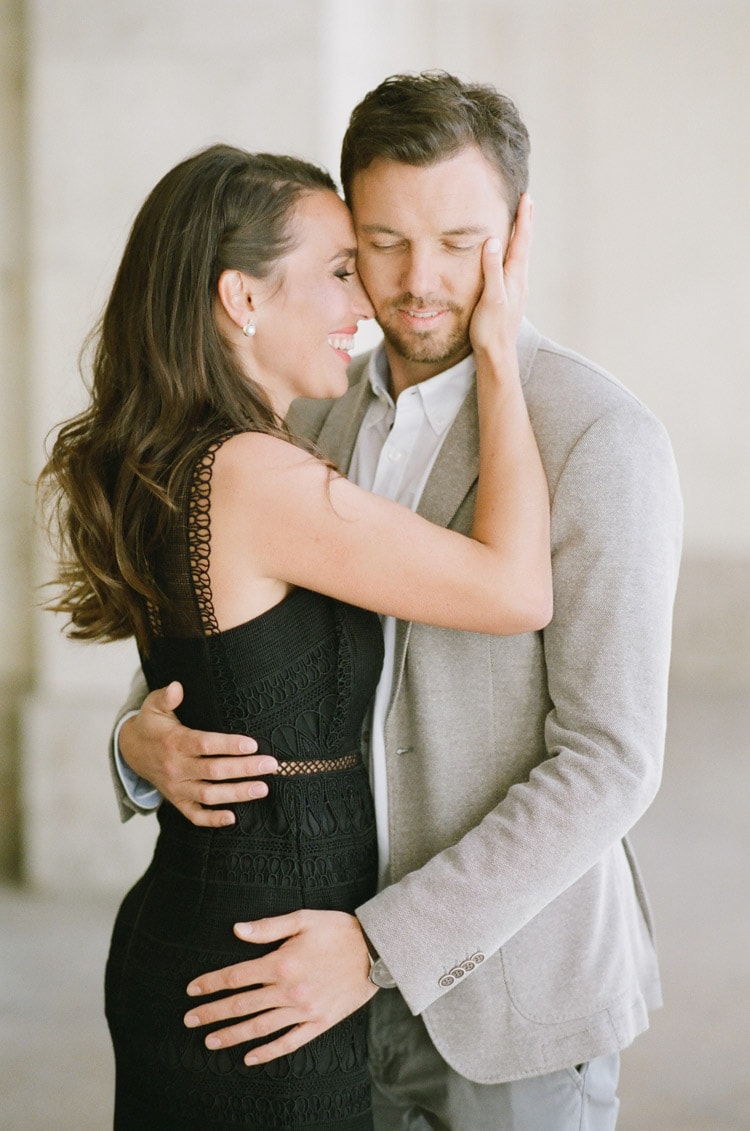 Couple laughing during their engagement portraits in Munich