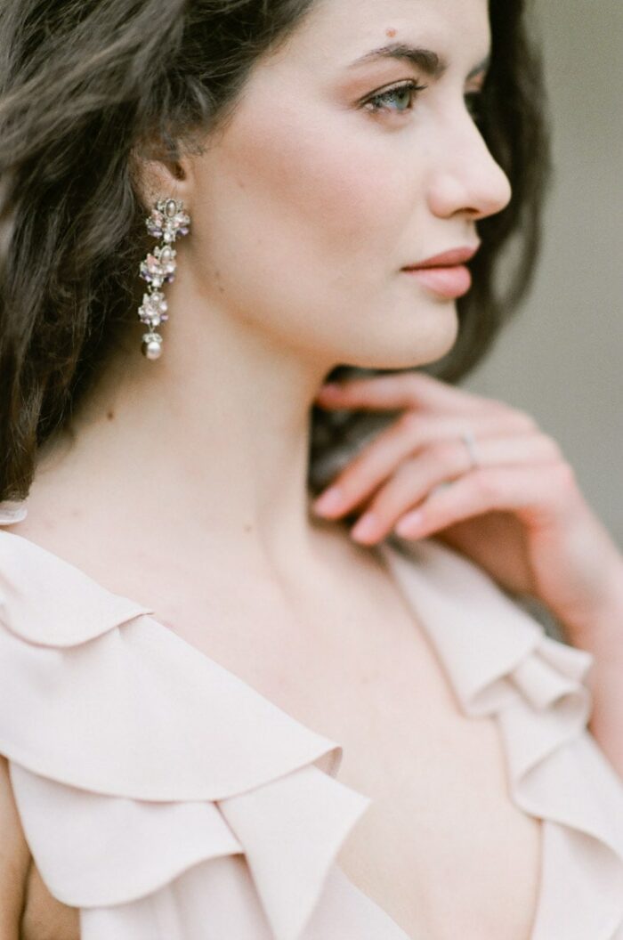 Woman wearing drop earrings