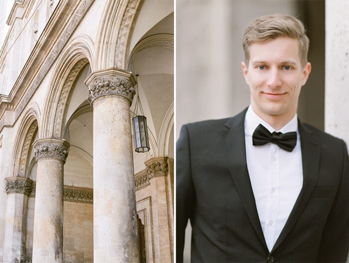 Man in bowtie standing in front of old columns in Munich