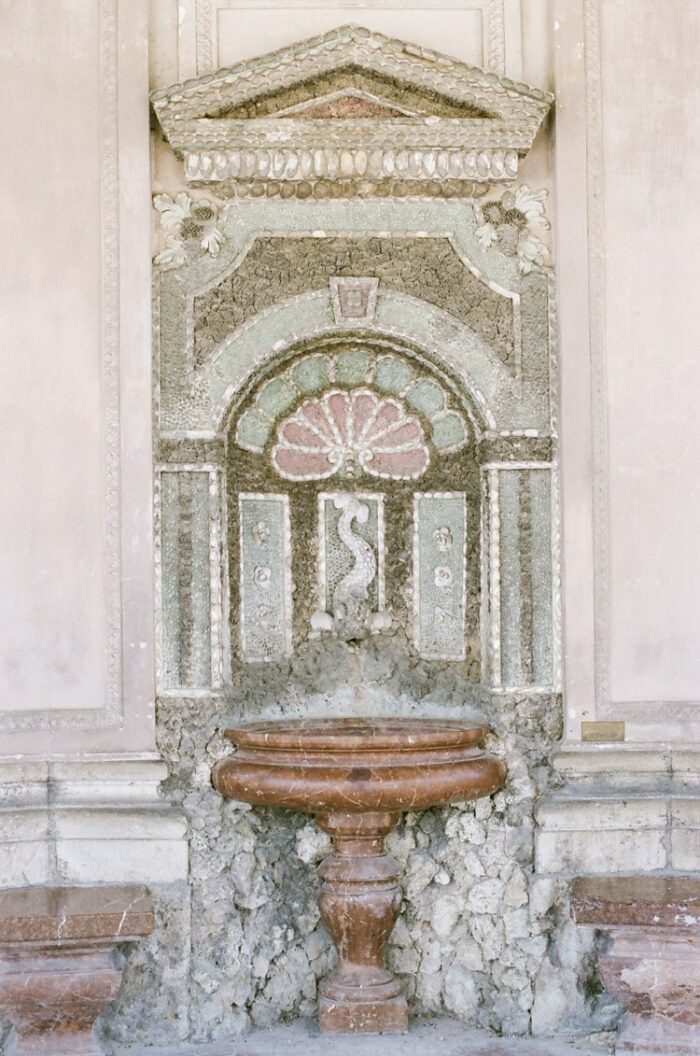 Fountain in Munich featuring pink and green tile work