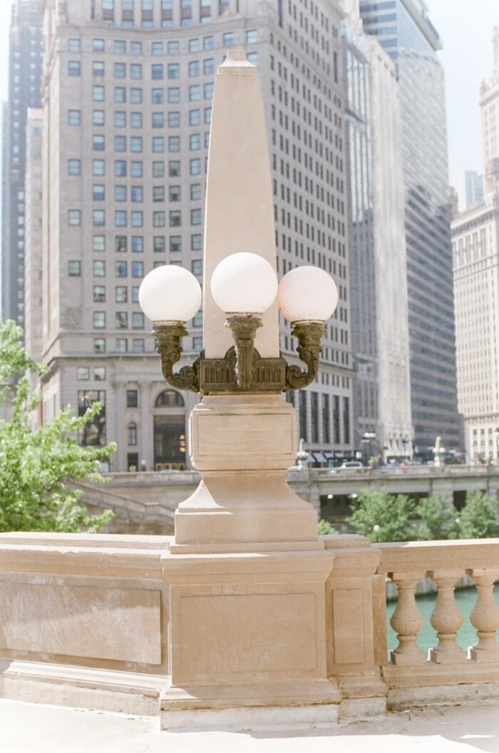 Chicago Riverwalk architecture next to river with buildings in the background
