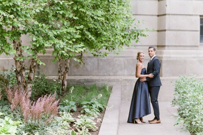 Distant couple embracing and smiling with Chicago flora