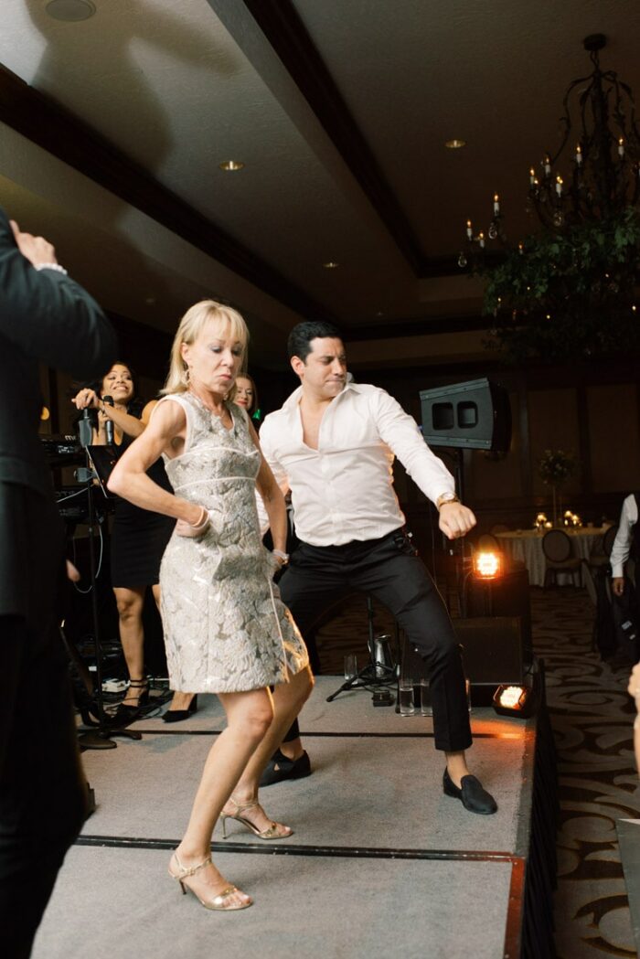 People dancing on the white dance floor