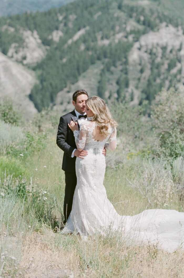 Wedding portrait of couple with mountains in the background
