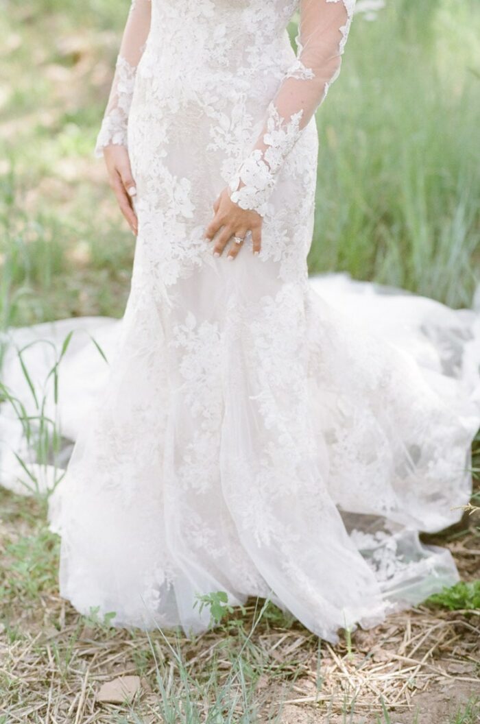 Lower half of wedding gown made of lace fabric designed by Monique Lhuillier