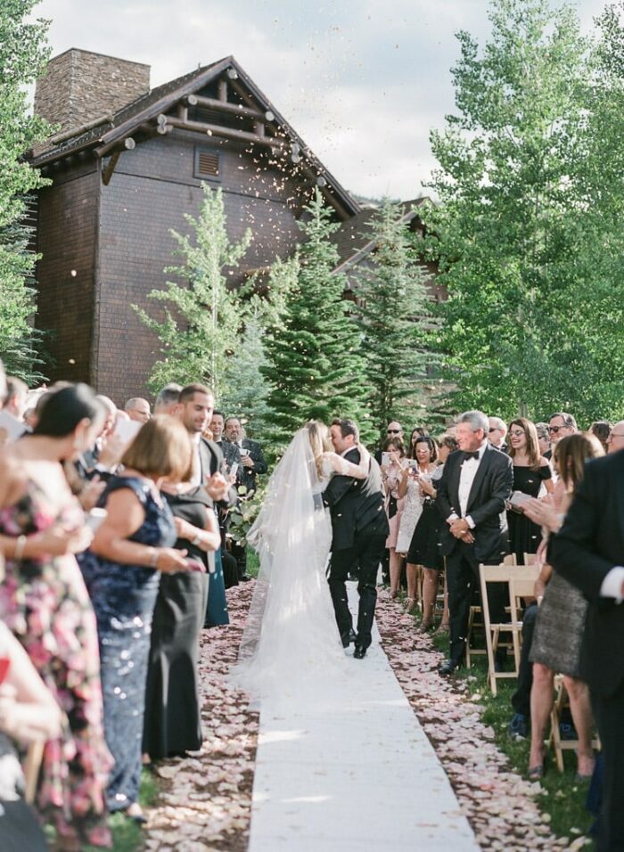 Married couple leaving wedding ceremony