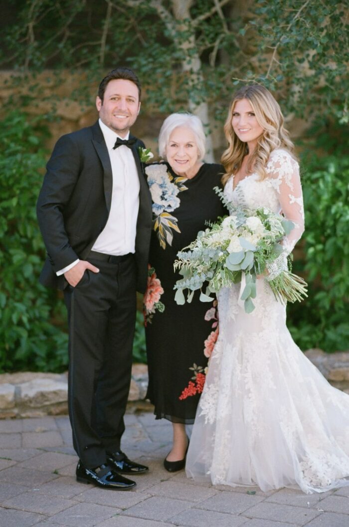 Bride and groom together with family member