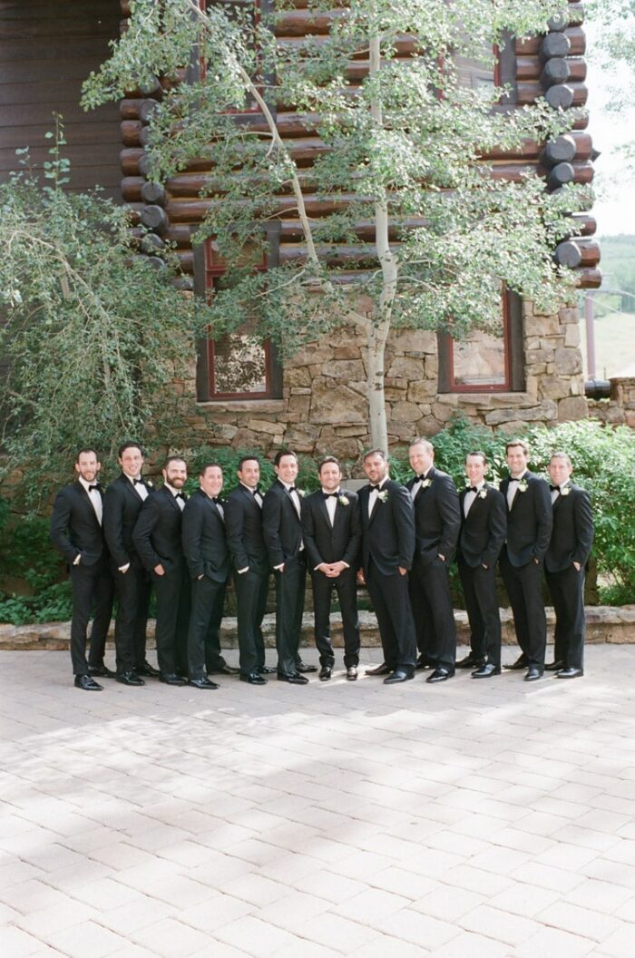 Groomsmen together in black tuxedos